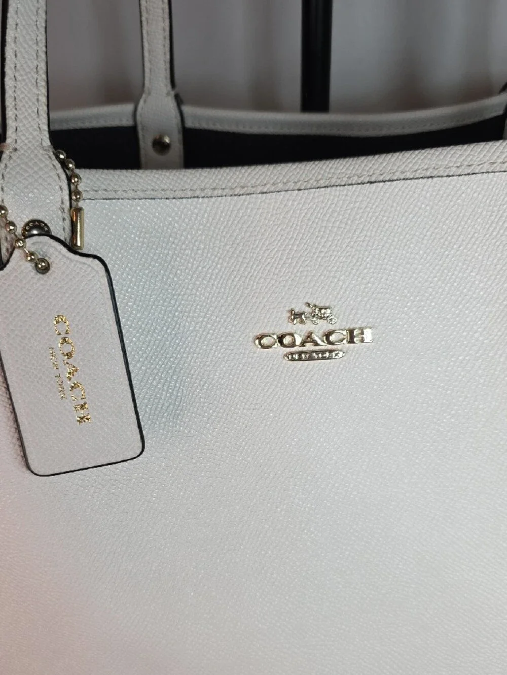 Coach Reversible City Tote crafted in light chalk leather